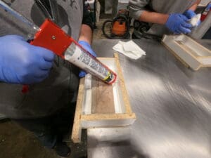 Caulking manufactured stone mold box